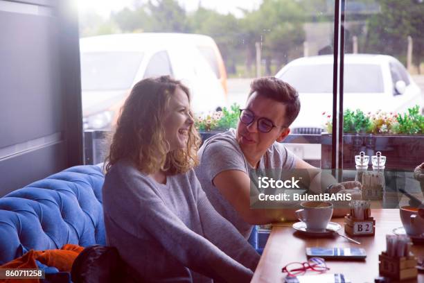 Happy Young Couple In A Cafe Stock Photo - Download Image Now - 20-29 Years, Adults Only, Beard