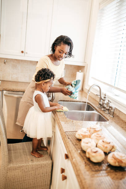 istock Mom and toddler baking together 860721416