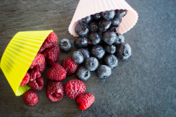 Healthy mixed fruit and ingredients with strawberry, raspberry, blueberry, blackberry from top view