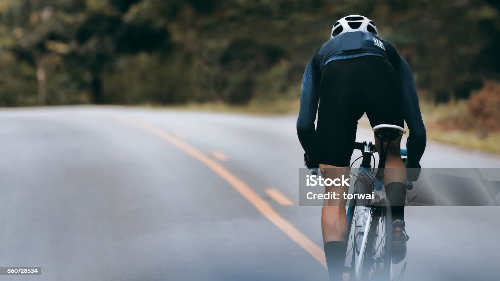 Cyclist increase speed by sprint. Cycling Stock Photo