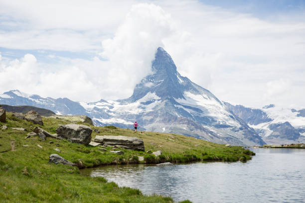 istock Woman running on a mountain trail 860736032