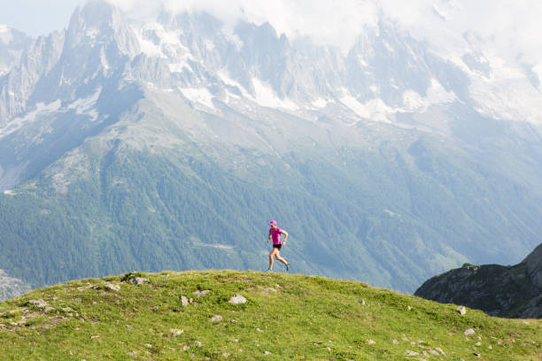 istock Woman running on a mountain trail 860736278