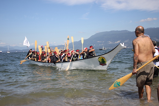 July 14, 2017. Canada. Vancouver.  Vanier Park. Gathering of Canoes, one of the signature events of Canada 150 celebration. During 10-day journey about 30 canoes with First Nations, Public Service Agencies and youth paddlers travel from the Sunshine Coast to the City of Vancouver and request permission to land on the traditional territories of the Musqueam, Squamish and Tsleil-Waututh First Nations.