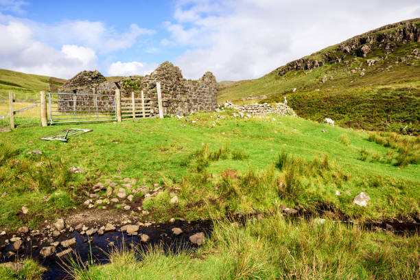 istock Mountain stream and ruined croft house, Isle of Skye 860736552