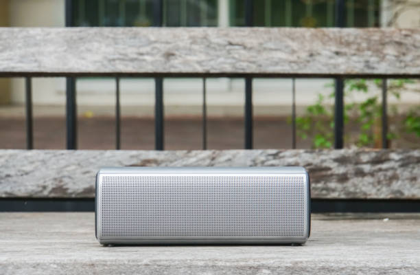 istock creative design portable wireless bluetooth speaker for music listening on wooden bench 860739424