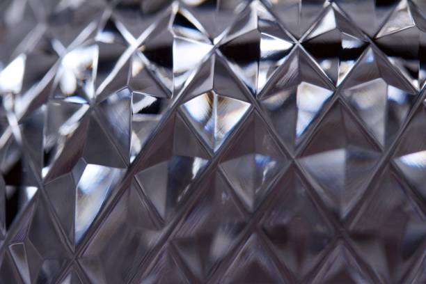 Macro Lead Crystal Facets Abstract Background This abstract background features an artistic defocused macro view of beautiful hand cut lead crystal facets lead cut glass crystal stemware stock pictures, royalty-free photos & images