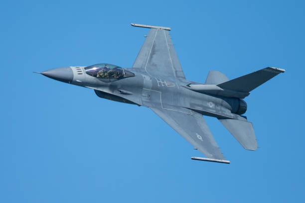istock F-16 Fighting Falcon approaching at a very unusual close view 860746432