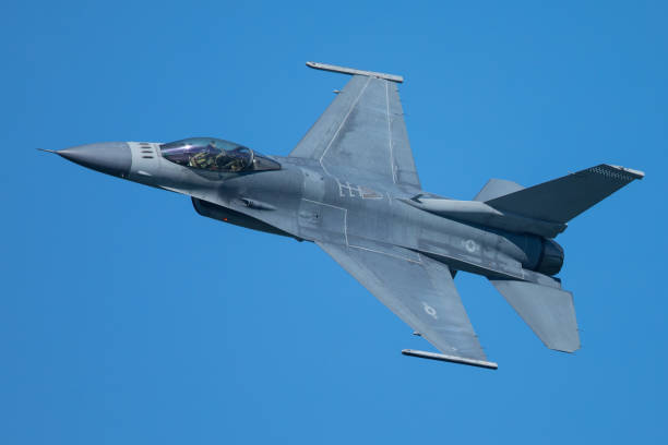 istock F-16 Fighting Falcon approaching at a very unusual close view 860746466