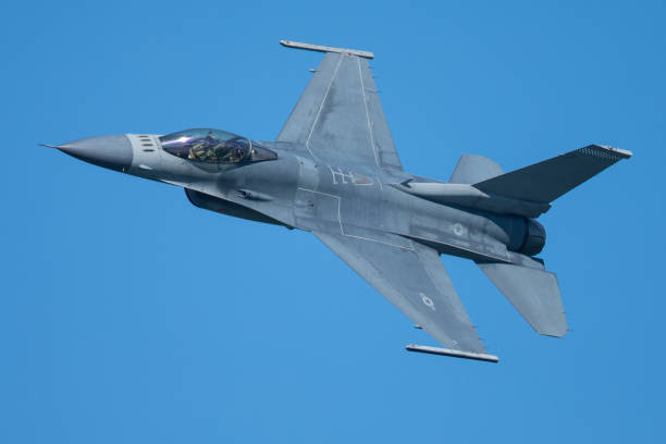istock F-16 Fighting Falcon approaching at a very unusual close view 860746502