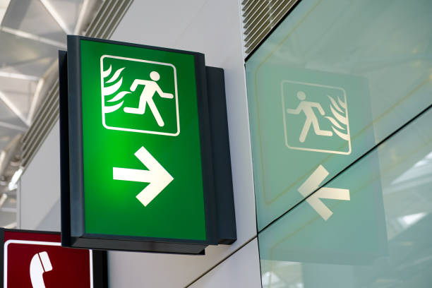 Fire Exit Sign Lightbox in the airport Fire Exit Sign Light box in the airport emergency exit photos stock pictures, royalty-free photos & images