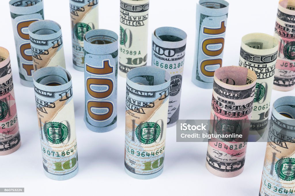 Dollar. Dollar banknotes roll in other positions. American US currency on white board. American dollar banknote rolls in all denominations on white background Ohio State University Stock Photo