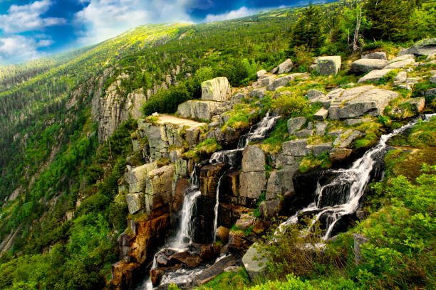 Pancavsky waterfall in Krkonose mountain - Czech republic. Waterfall with rock and forest.