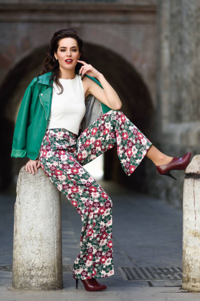 istock Young brunette woman smiling in urban background. 860767196