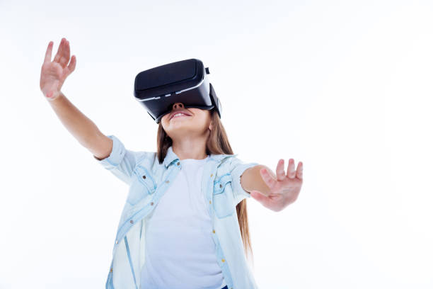 istock Positive smart girl experiencing virtual reality 860770492