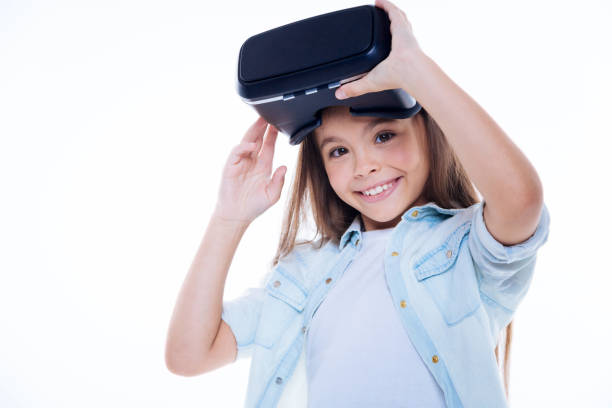 istock Happy pretty girl taking off 3d glasses 860770924
