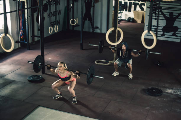 istock Young couple exercising in  gym 860771106