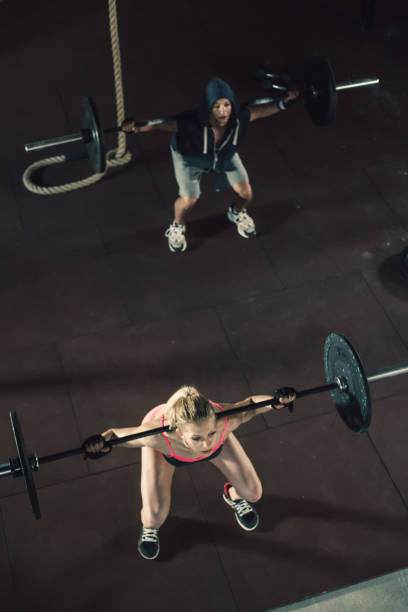 istock Young fit couple doing dead lifts 860771116