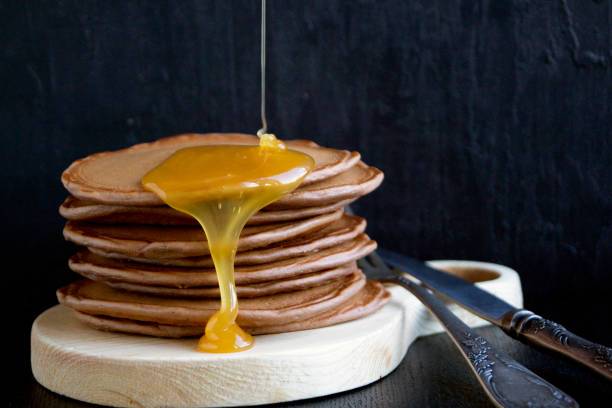 istock Homemade pancakes with honey. 860771856