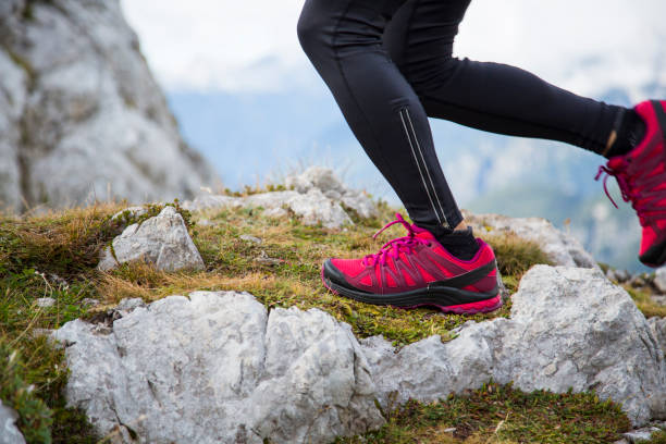 istock Female hiker on ridge, view on hiking boots 860782814