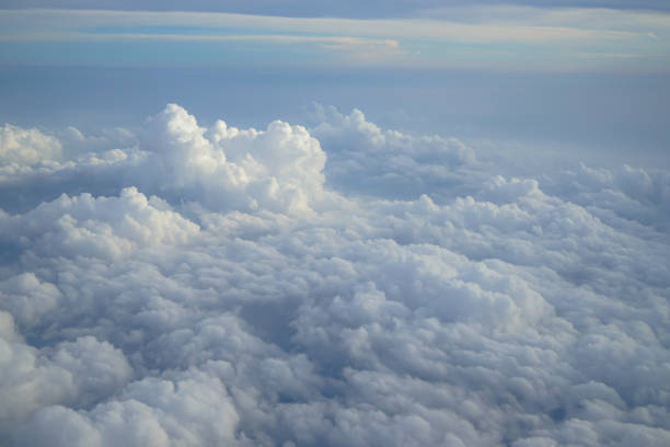 istock Shades of light blue color sky and constantly change floating white cloud heaven view from airplane window 860783218