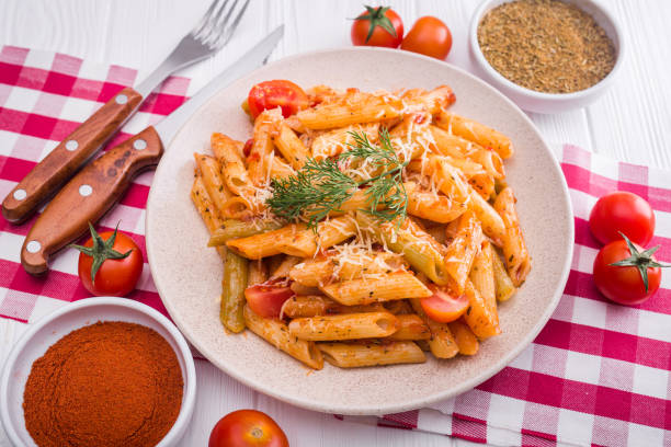 istock delicious penne pasta on wood white table 860786124