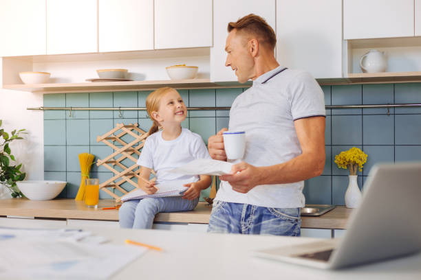 istock Smart friendly man talking to his daughter 860787160