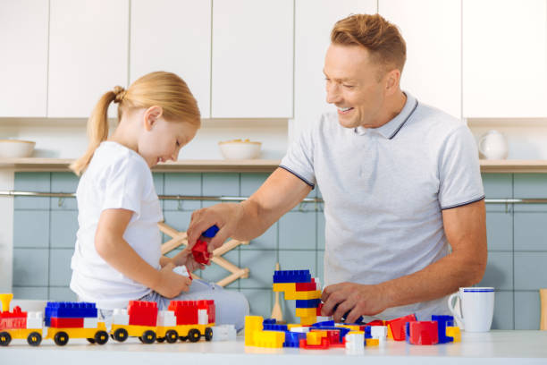 istock Delighted positive man having fun with his daughter 860790064