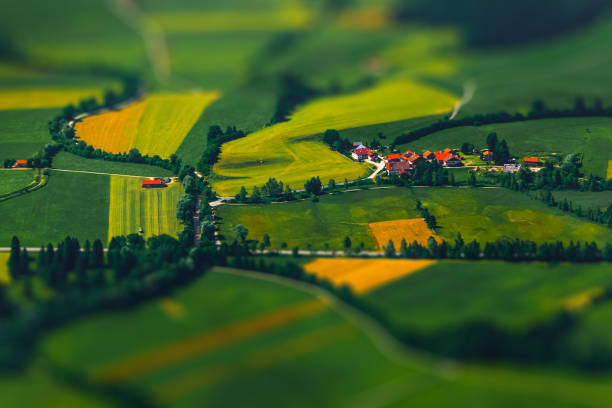 Little village among the green fields. Germany. Tilt shift effect applied