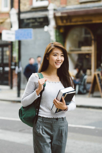 istock Asian Student Carrying Books 860794588