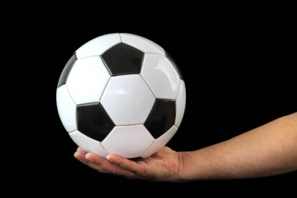 istock Soccer ball on a hand 860797552
