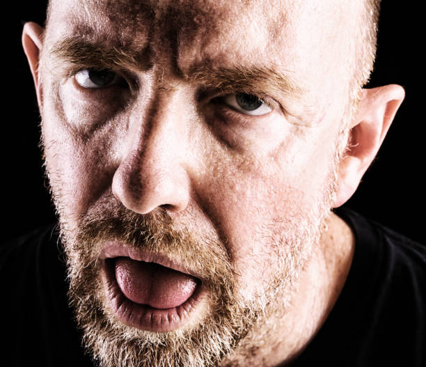 istock A mature bearded man looks exhausted, sleepy and stressed 860801244