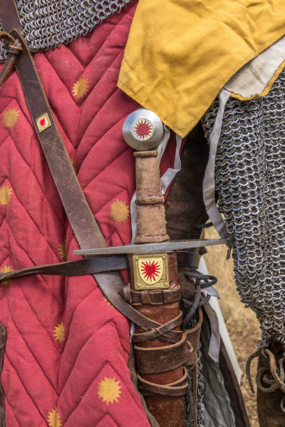 istock Medieval sword hilt detail, chainmail, sword and shields a medieval armor knight 860812892