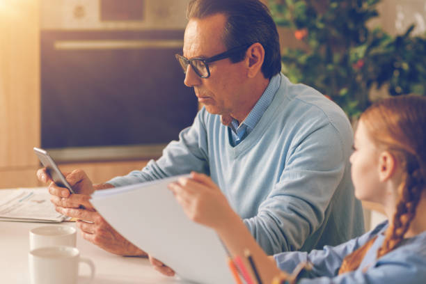 istock Side view on busy father ignoring his child at home 860813298