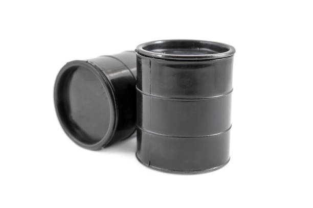 istock Two decorative black fuel oil barrel on white. 860816594