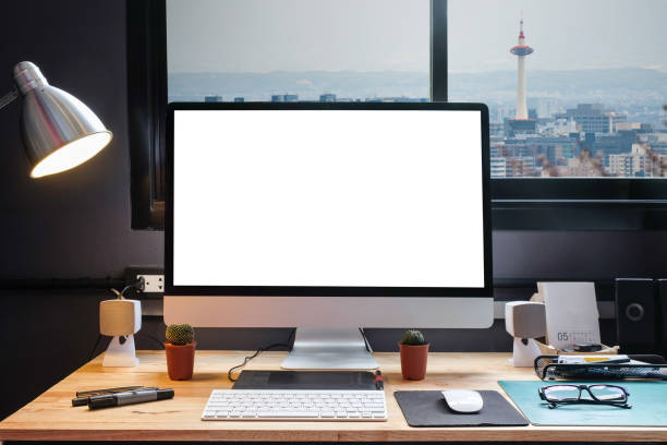 istock Graphic designer's workspace equipped with a pen tablet, a computer and white screen for text with beautiful sunset on moutain from the window 860821624