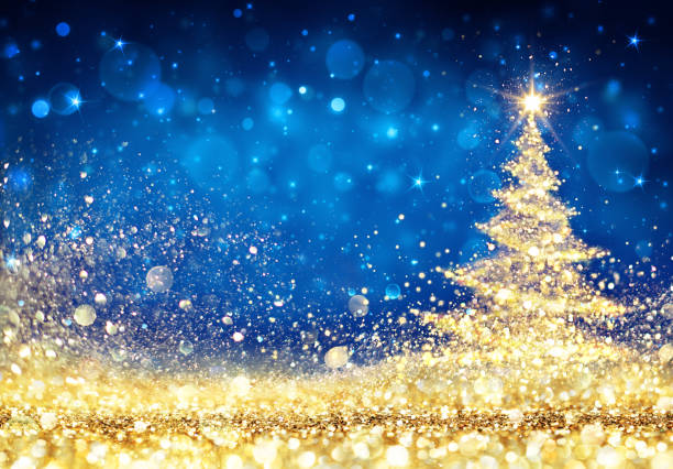 istock Shiny Christmas Tree - Golden Dust Glittering In The Blue Background 860821692
