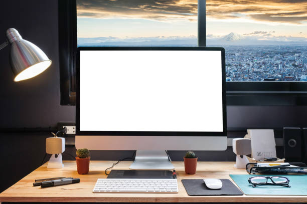 istock Graphic designer's workspace equipped with a pen tablet, a computer and white screen for text with beautiful Snow Mountain Fuji in Japan from the window 860821714