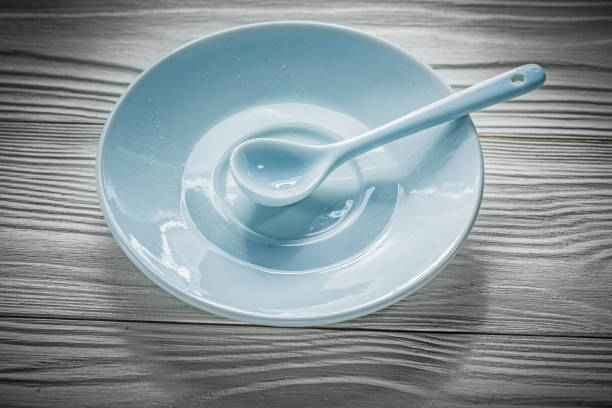 istock Coffee saucer spoon on vintage wooden board 860822062
