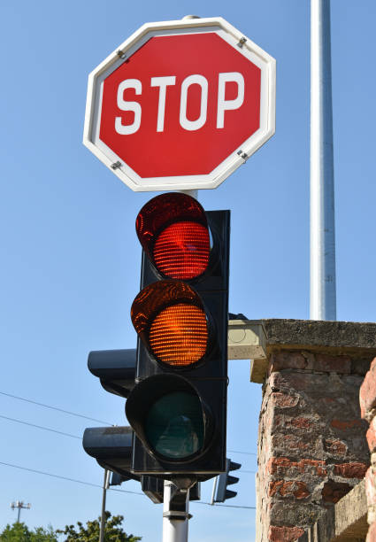 istock Stop sign and red light at the road crossing 860822306