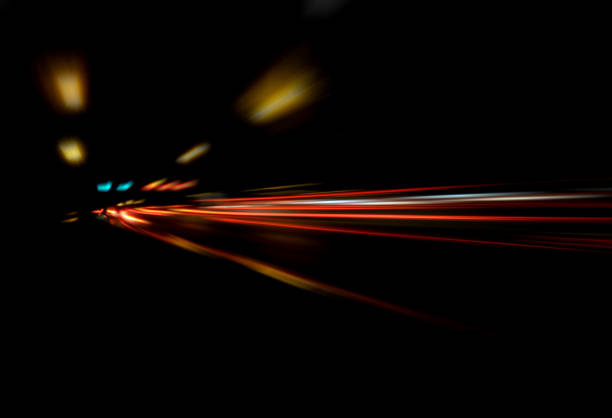 Blurry Illumination and night lights, car traffic motion blur the speed and dynamics