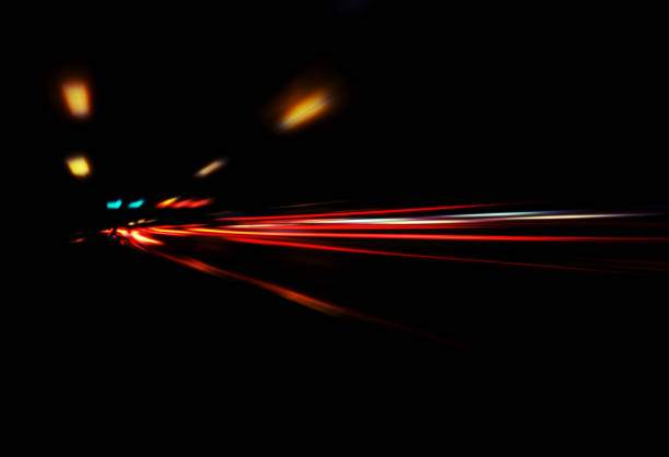 Blurry Illumination and night lights, car traffic motion blur the speed and dynamics