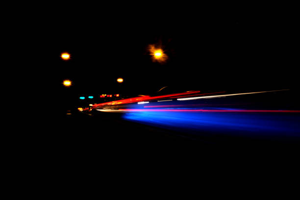 Blurry Illumination and night lights, car traffic motion blur the speed and dynamics