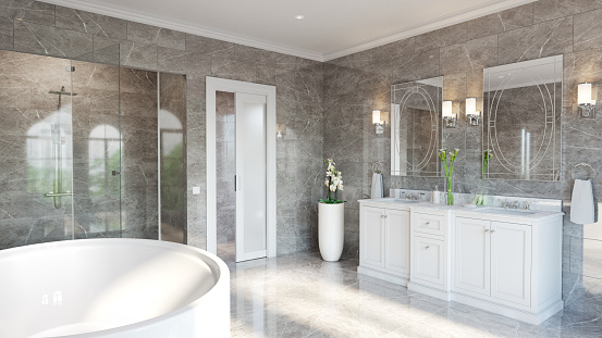 Classical double vanity, oval spa bath, recessed double shower with porcelain floor and wall tiling throughout.