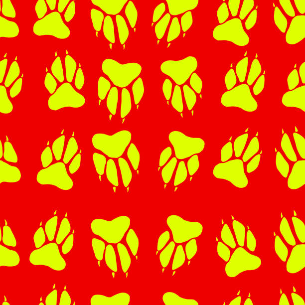 istock Bright yellow color paw print dog imprint seamless pattern, red 860830688