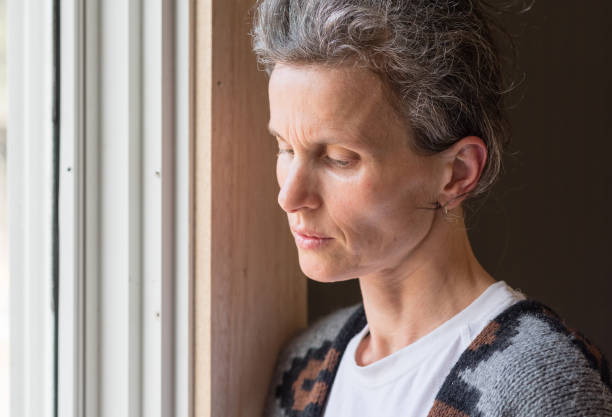 istock Middle aged woman looking pensive 860833618