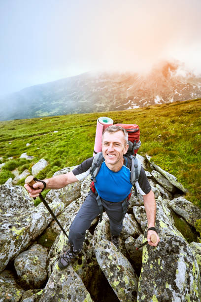 istock Hiking in the mountains in the summer with a backpack. 860833850