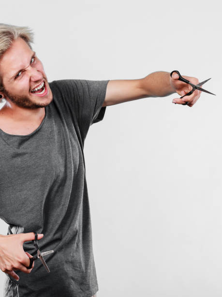 istock Man with scissors for haircutting 860841686