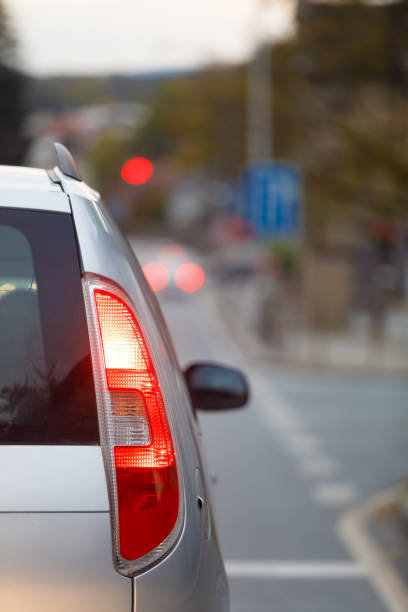 istock back of car waiting at the red light 860847868