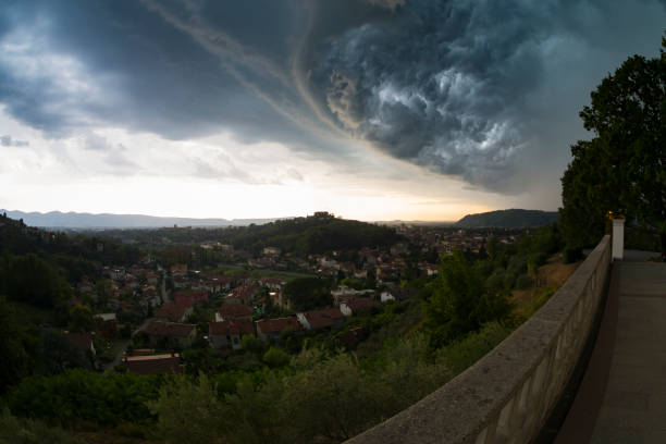 istock Magnificent storm cloud formations engulf the city 860848116