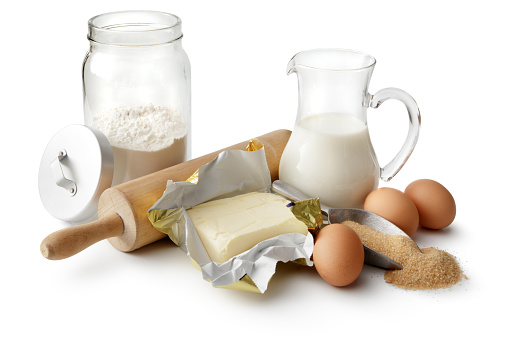 Baking: Flour, Butter, Eggs, Sugar and Milk Isolated on White Background